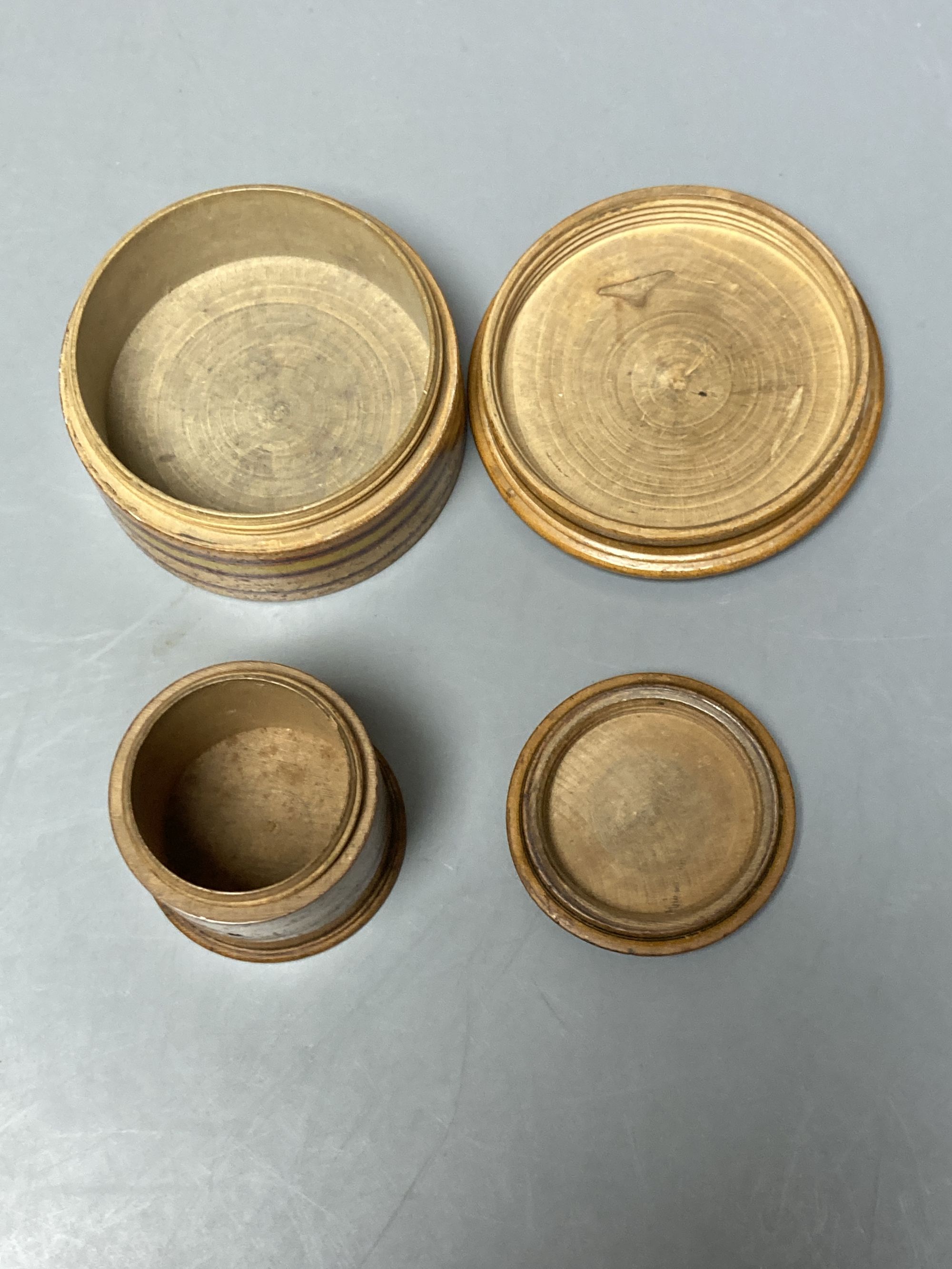 Two early Tunbridge ware sycamore 'Brighton Pavilion' boxes, 8.3 and 5.3cm diameter and a similar 'Brighton trifle' sewing clamp, early